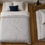Taille de couette pour lit 90x190 : couette 140x200 sur matelas 90x190